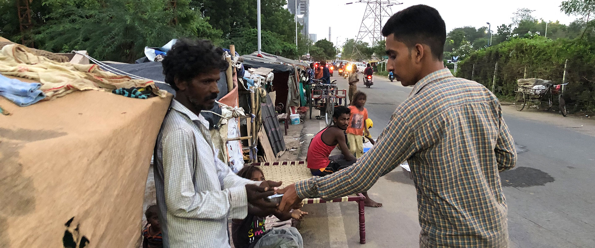 distributing food to homeless family by SuperApps
